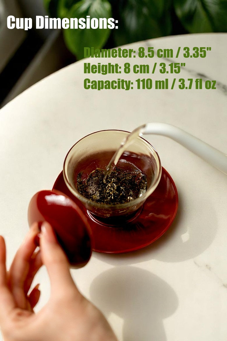 Holding a Cinnabar Red Glass Gaiwan for Brewing
