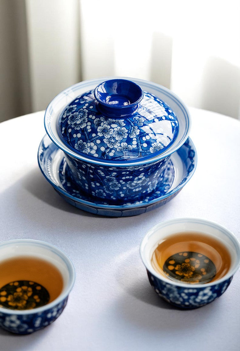 Chinese blue and white gaiwan with matching teacups on tray