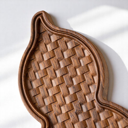Top view of gourd-shaped bamboo tea tray with woven texture