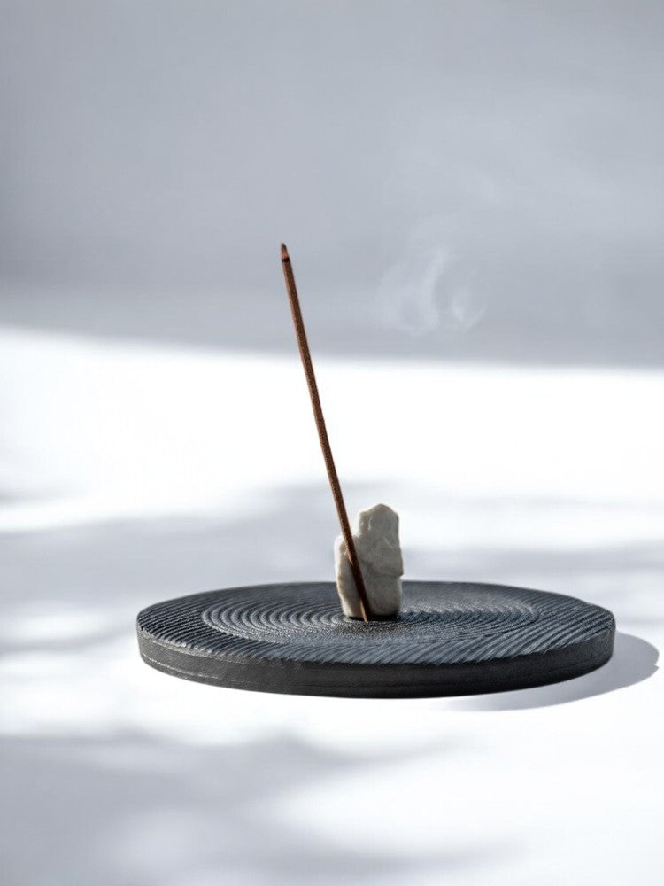 Karesansui-style black incense holder with burning incense stick