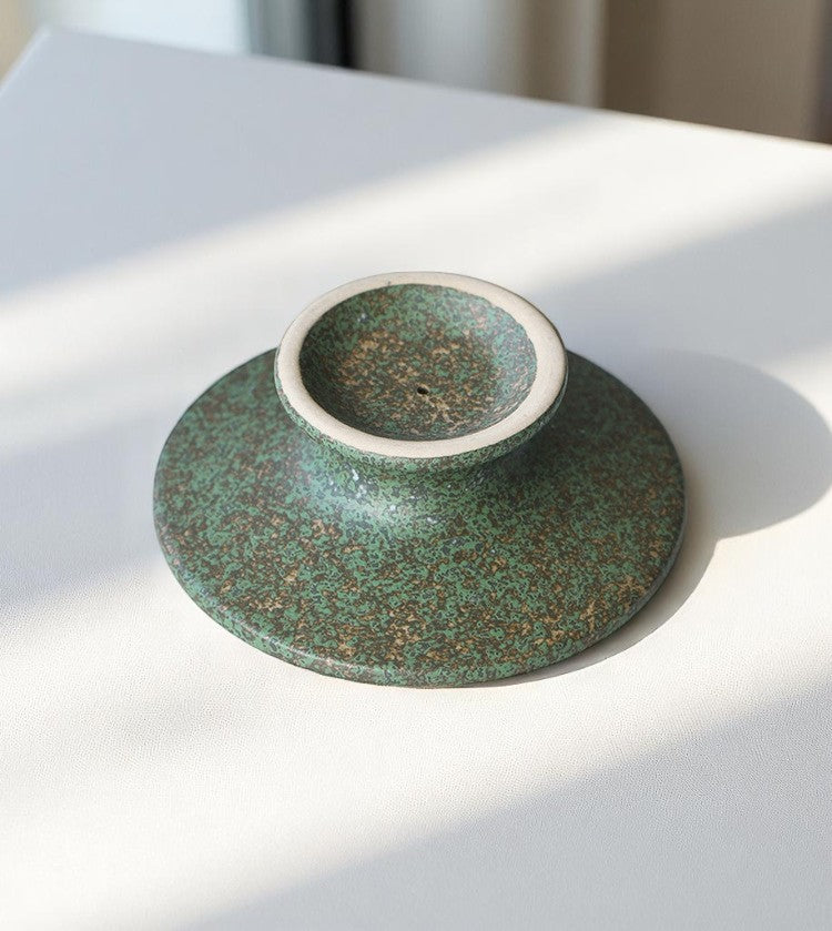 Underside of ceramic pedestal holder, rounded base with texture