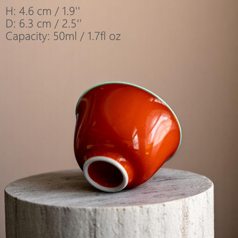 Underside of red ceramic teacup with smooth high-fired finish