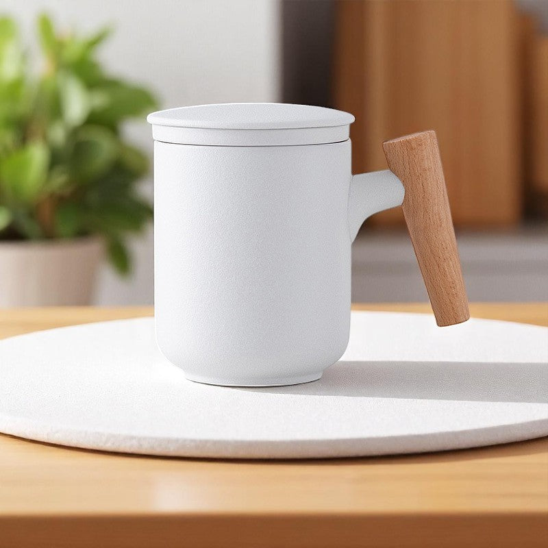 White ceramic tea mug with removable infuser and lid pieces