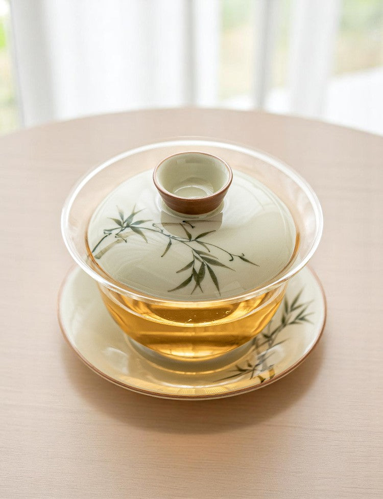 Tea cup with lid on a saucer on a wooden table