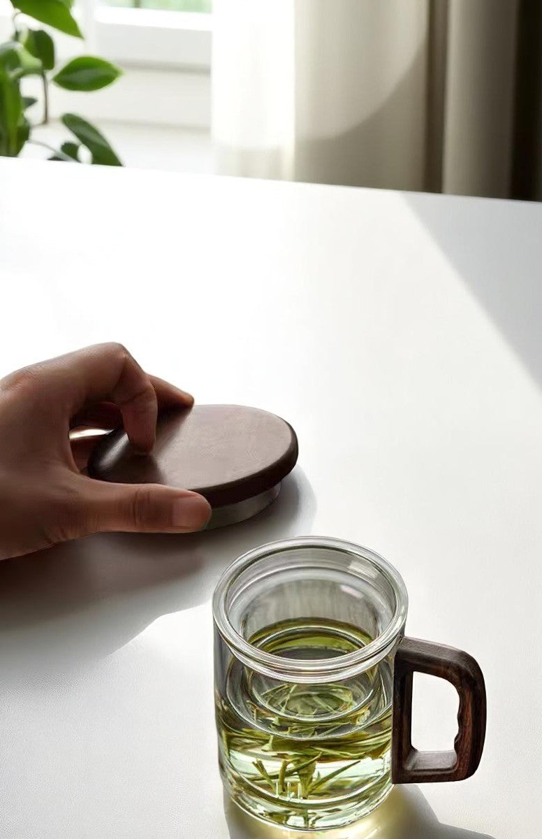 Overhead view of tea infuser mug with filter and stainless steel lid