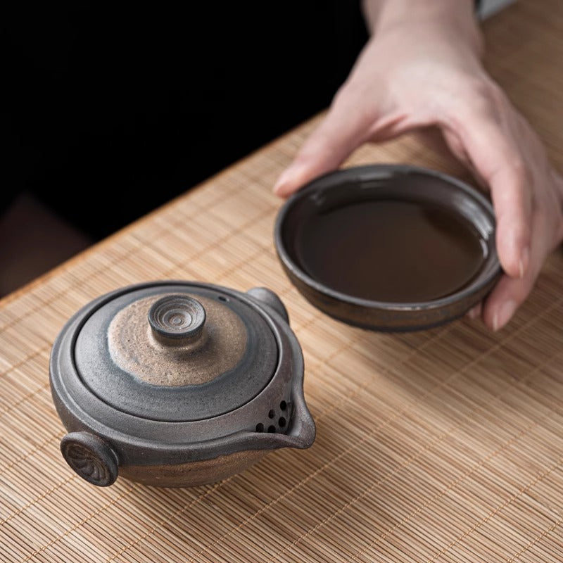 close-up of teaware with textured clay and soft lines