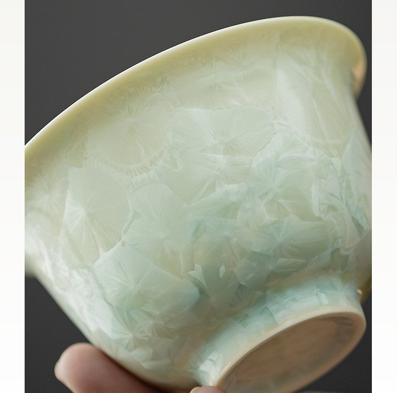 Bottom of jade-tone gaiwan showing unglazed foot and glaze pool
