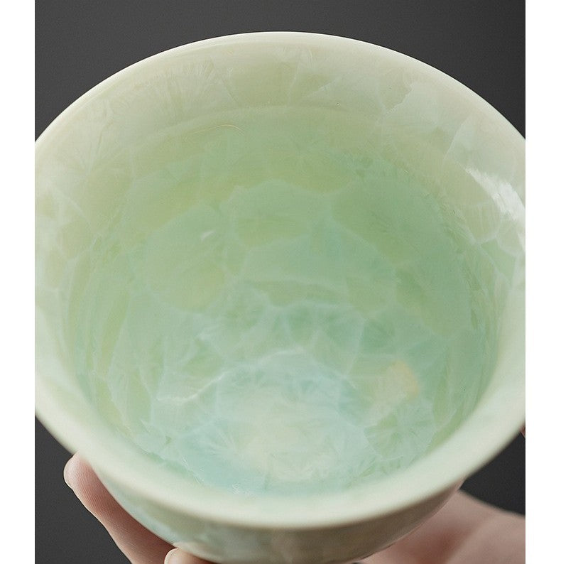 close-up of icy glaze pattern on jade-colored ceramic bowl