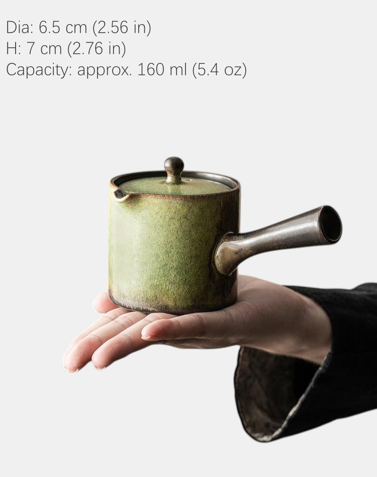 Holding moss green teapot with side handle for one-handed brewing