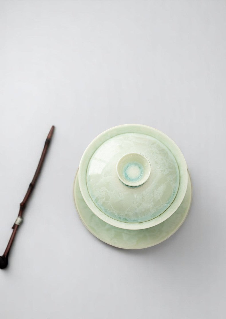 Lid-centered view of porcelain gaiwan with satin crystal finish