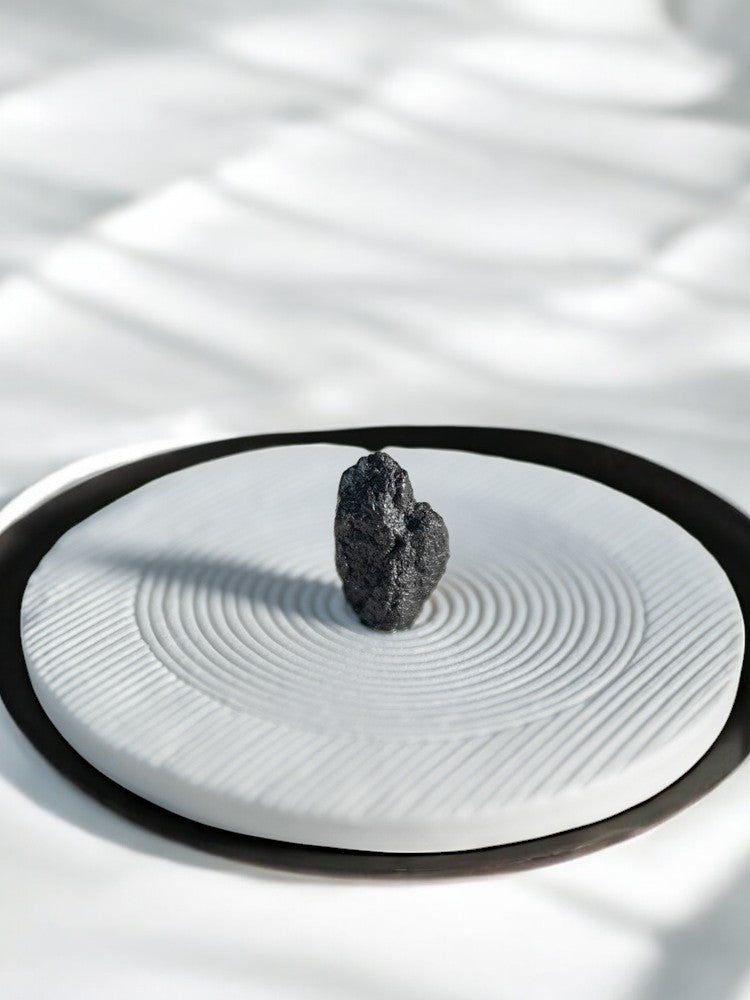 White spiral incense burner in minimalist Japanese zen setting