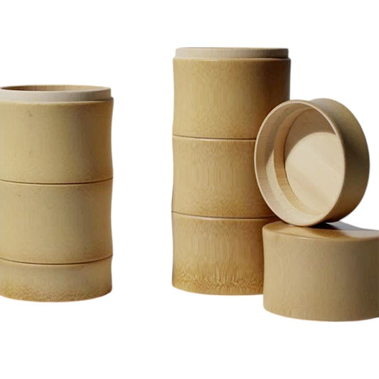 Stacked bamboo tea jars with lid open, eco-friendly tea storage