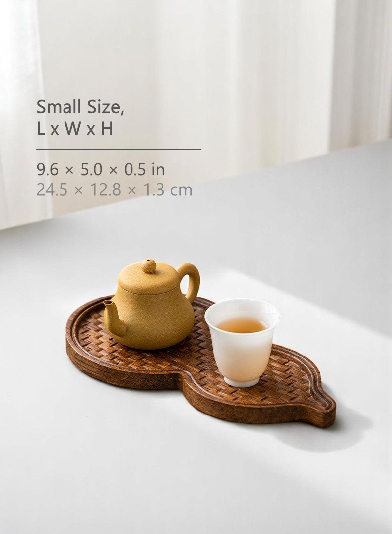 small bamboo tea tray placed near window