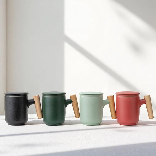 Colorful ceramic tea mugs with wooden handles and matte finish
