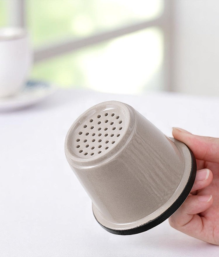 nderside of ceramic infuser with smooth matte glaze finish